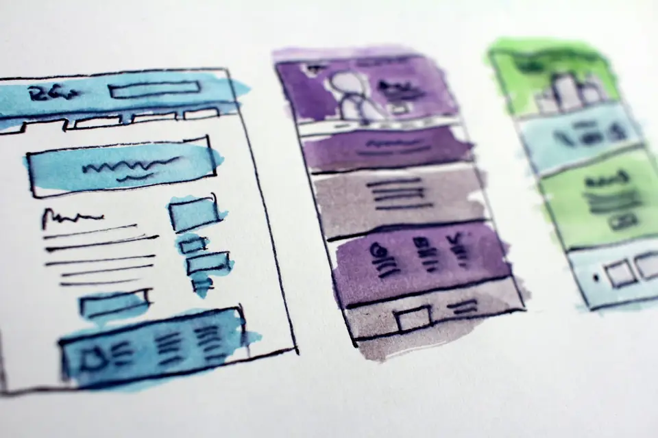 Website wireframe sketches on paper